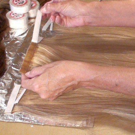 Single side seamless hair extension tape on a roll