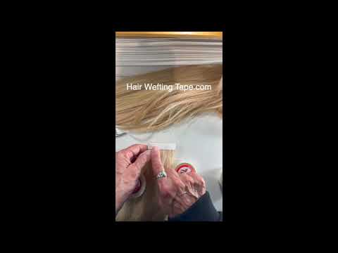What is a white release liner on a roll of hair extension tape.